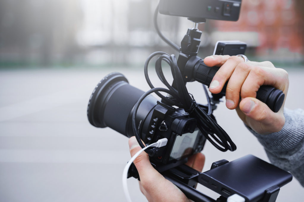 Videographer holding a camera